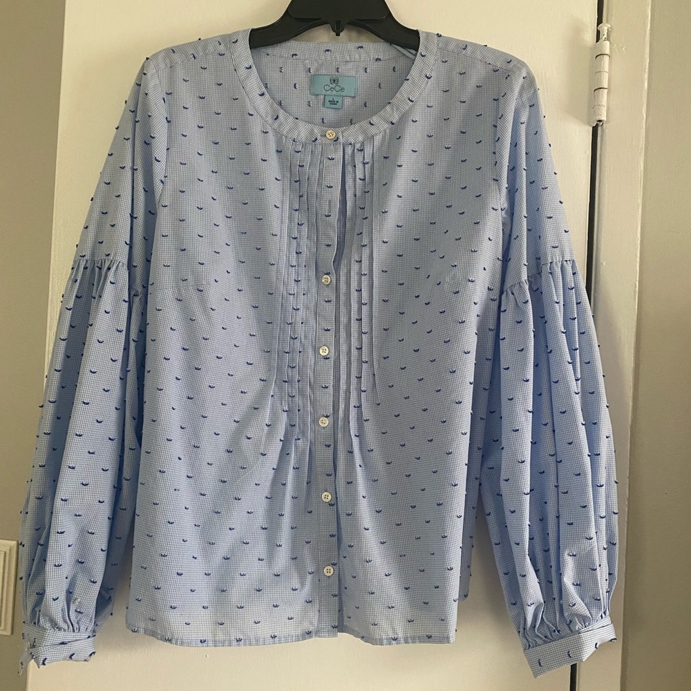 Light blue shirt with delicate print. Size large. Sleeves puff at elbows